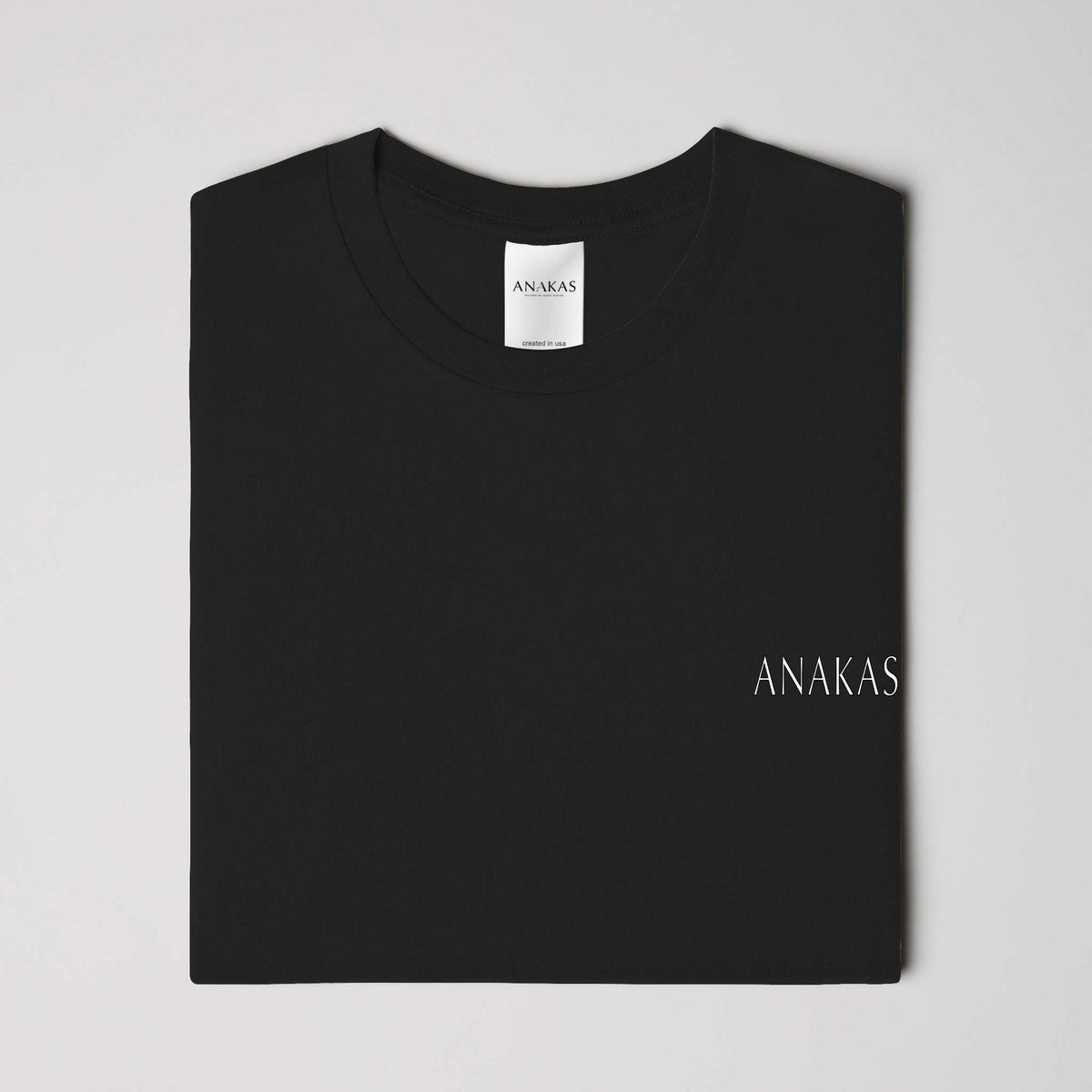 ANAKAS Heavyweight Tee in Black, folded view